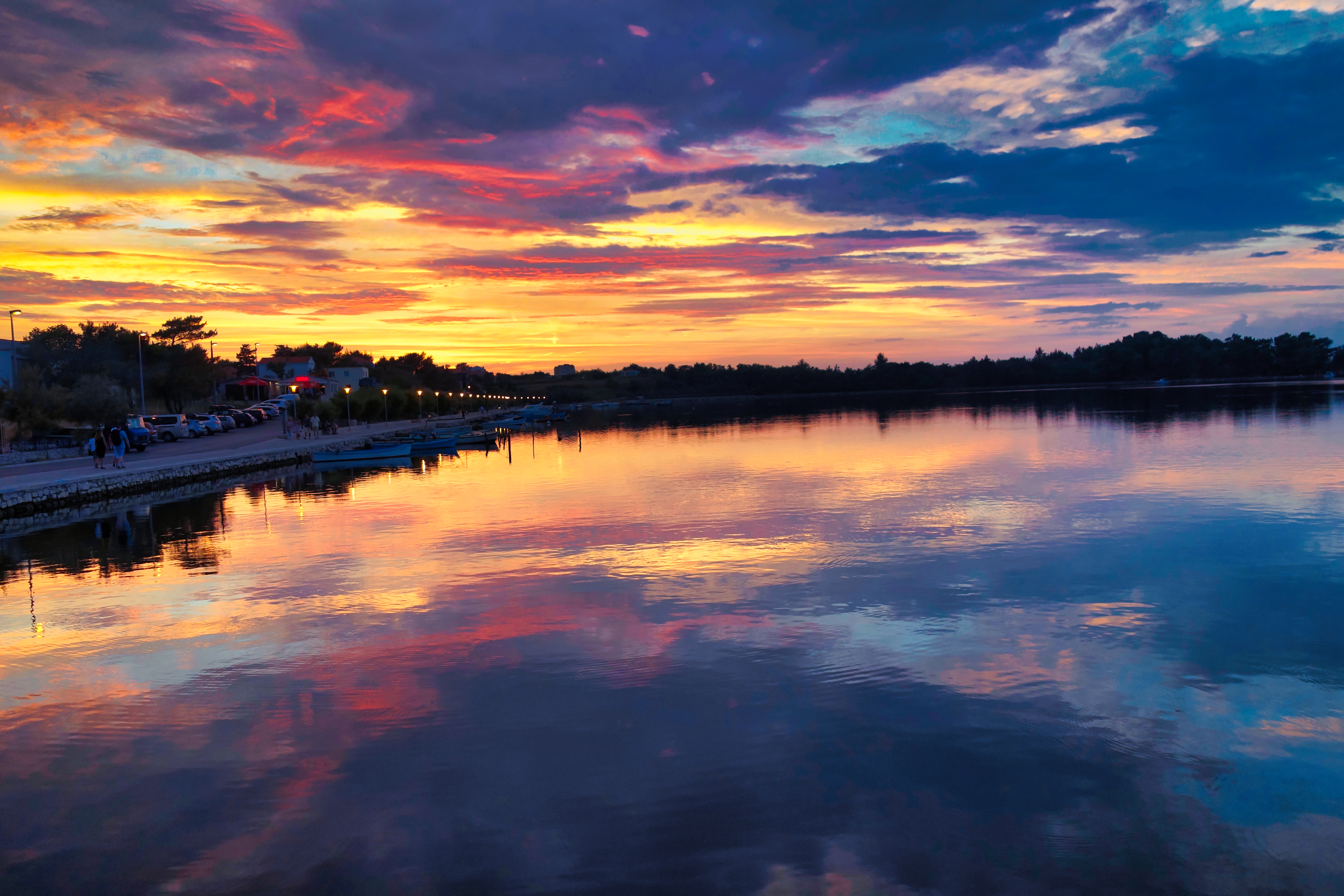 Dramatic sunset reflected in calm water